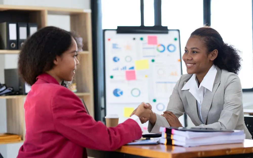 two businesswomen stiting and talking